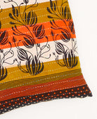 kantha square pillow in black with orange & white stripe pattern with white embroidery