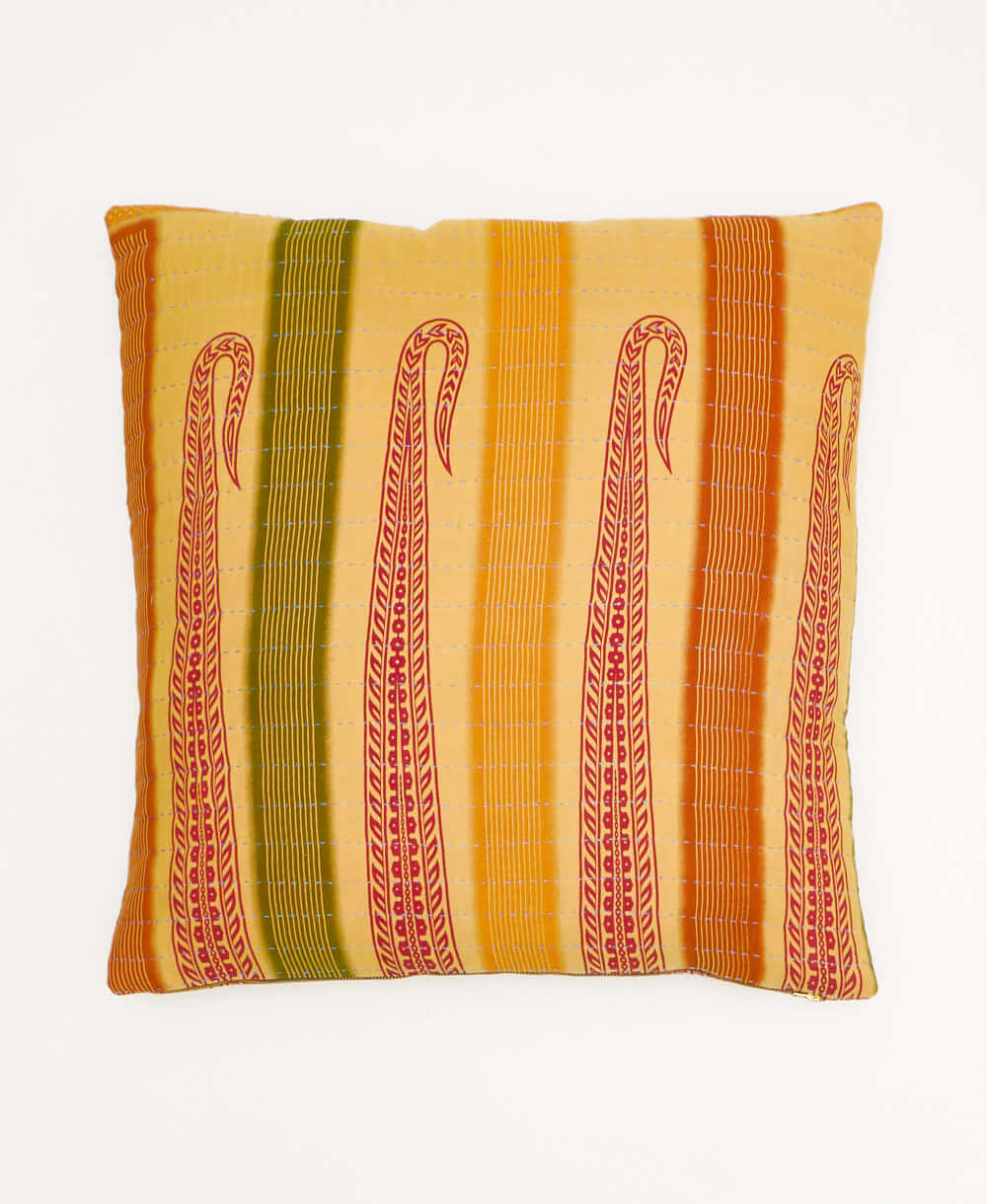 pale yellow throw pillow with an orange & olive stripe print made from vintage cotton saris in India