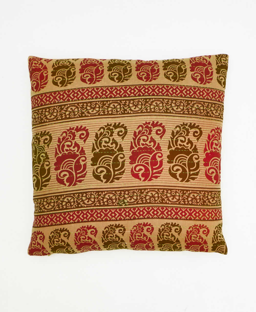 colorful throw pillow in light green made from vintage fabrics with hand-stitched embroidery in an abstract print