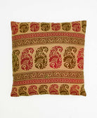 colorful throw pillow in light green made from vintage fabrics with hand-stitched embroidery in an abstract print