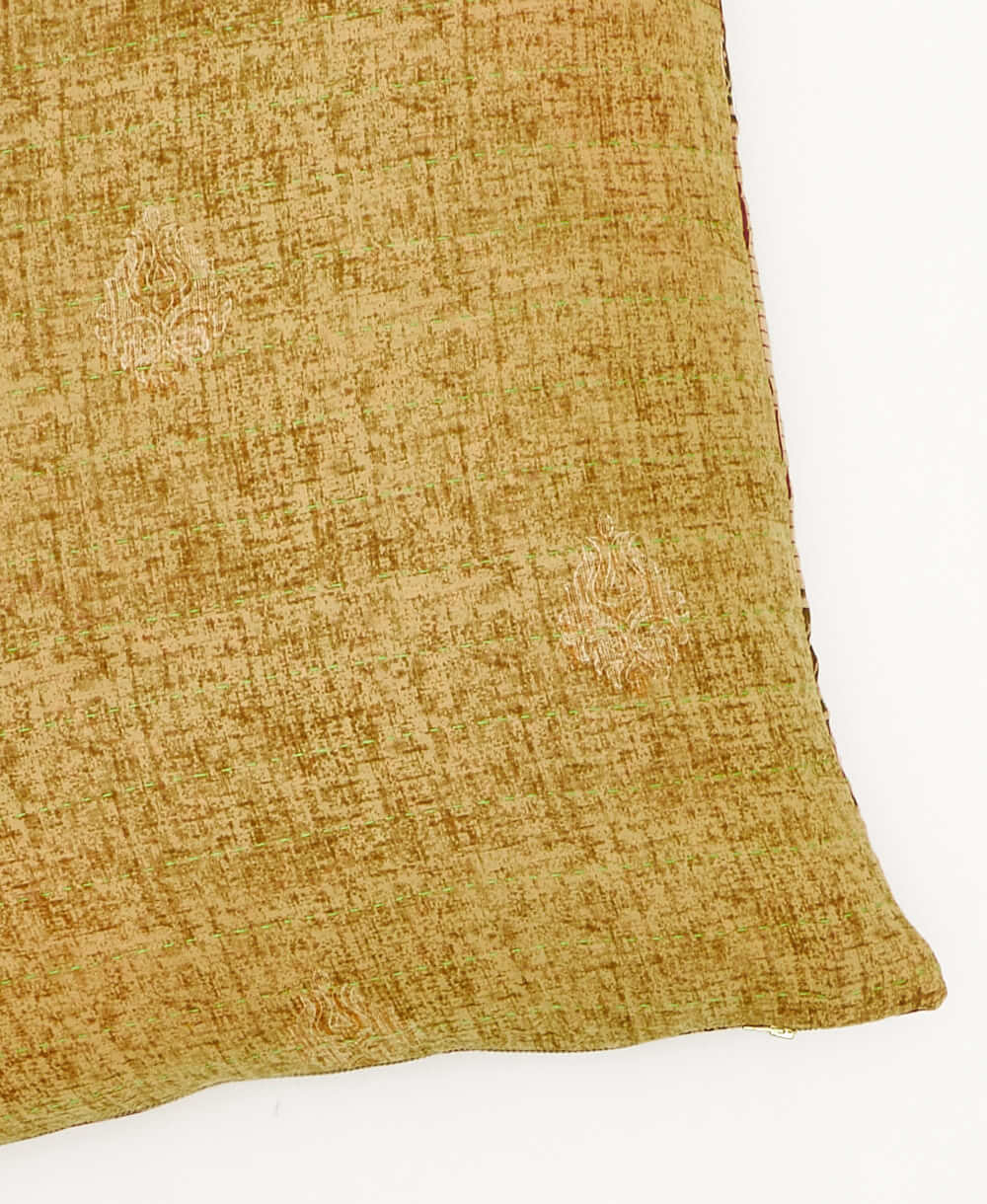 kantha square pillow in light green with an abstract pattern with lime green embroidery