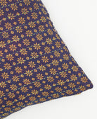 eggplant purple square pillow with light tan star pattern pattern