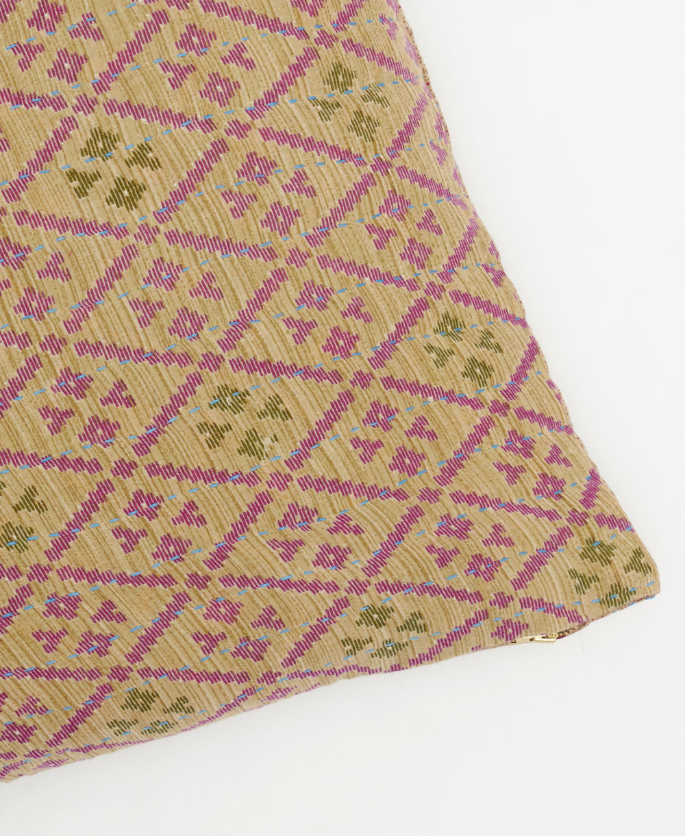 square pillow in beige with purple diamond pattern