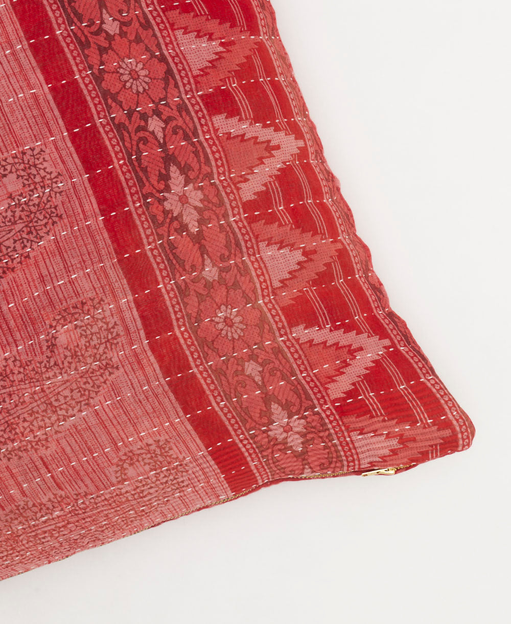 coral-red square pillow with light pink