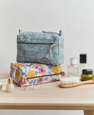 vintage floral toiletry bags made from vintage cotton saris in India & hand-embroidered by women