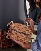 woman using vintage kantha toiletry bag