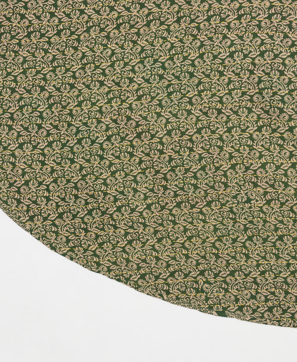 hunter green reversible tree skirt made with tan floral pattern and yellow kantha stitching