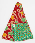 cherry red holiday tree skirt made from vintage cotton saris featuring a marigold & pastel green floral pattern