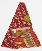 brick red holiday tree skirt made from vintage cotton saris featuring a tan and coral vine pattern