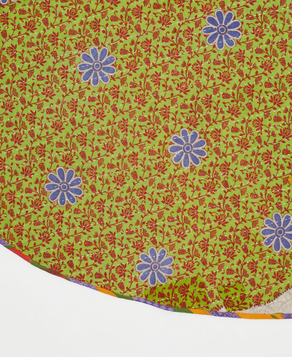 lime green reversible tree skirt made with maroon and blue floral pattern and white kantha stitching