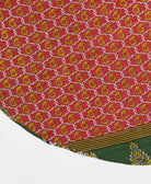 red reversible tree skirt made with mustard yellow paisley pattern and blue kantha stitching