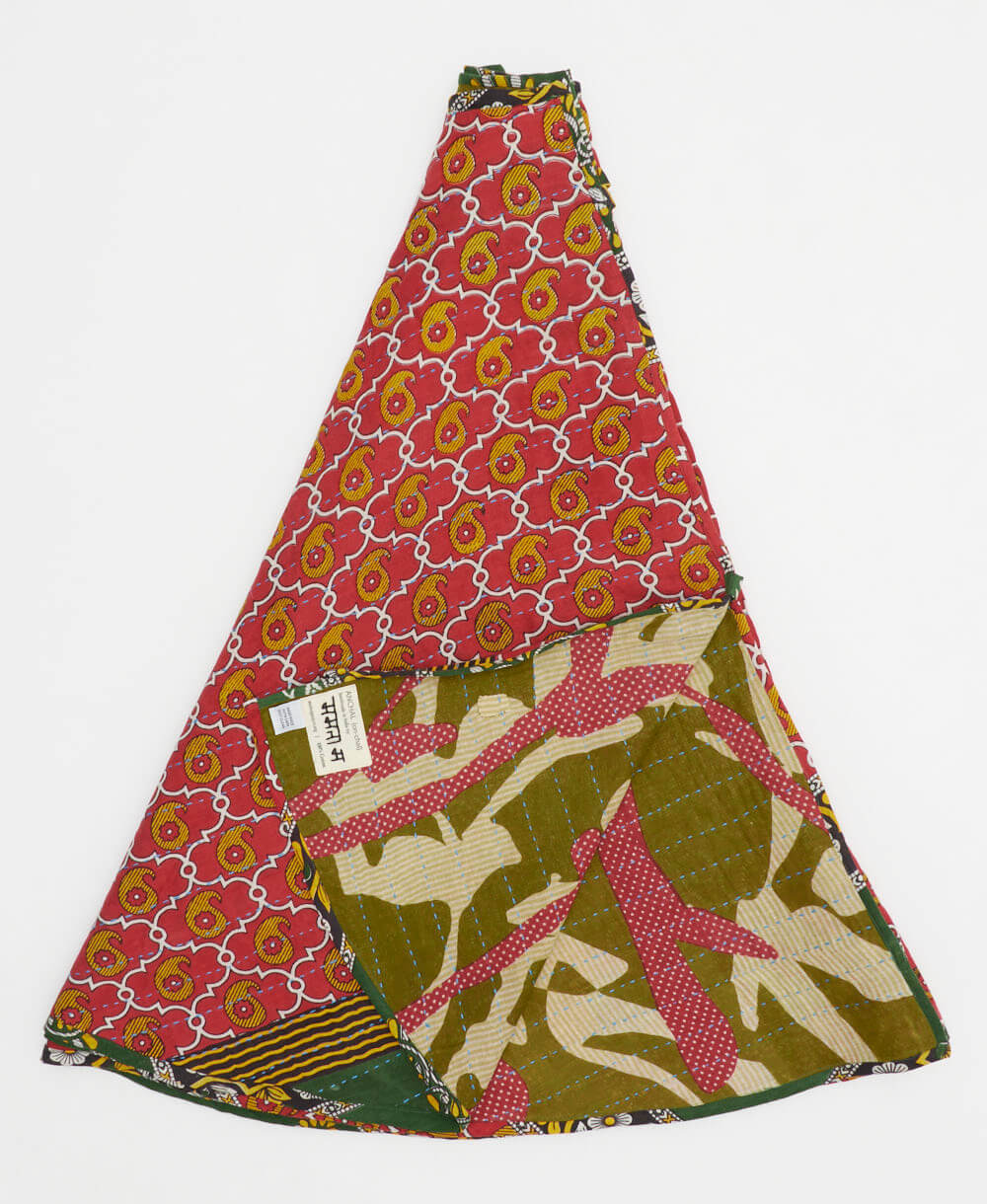 crimson red holiday tree skirt made from vintage cotton saris featuring a mustard yellow paisley pattern with olive abstract reverse