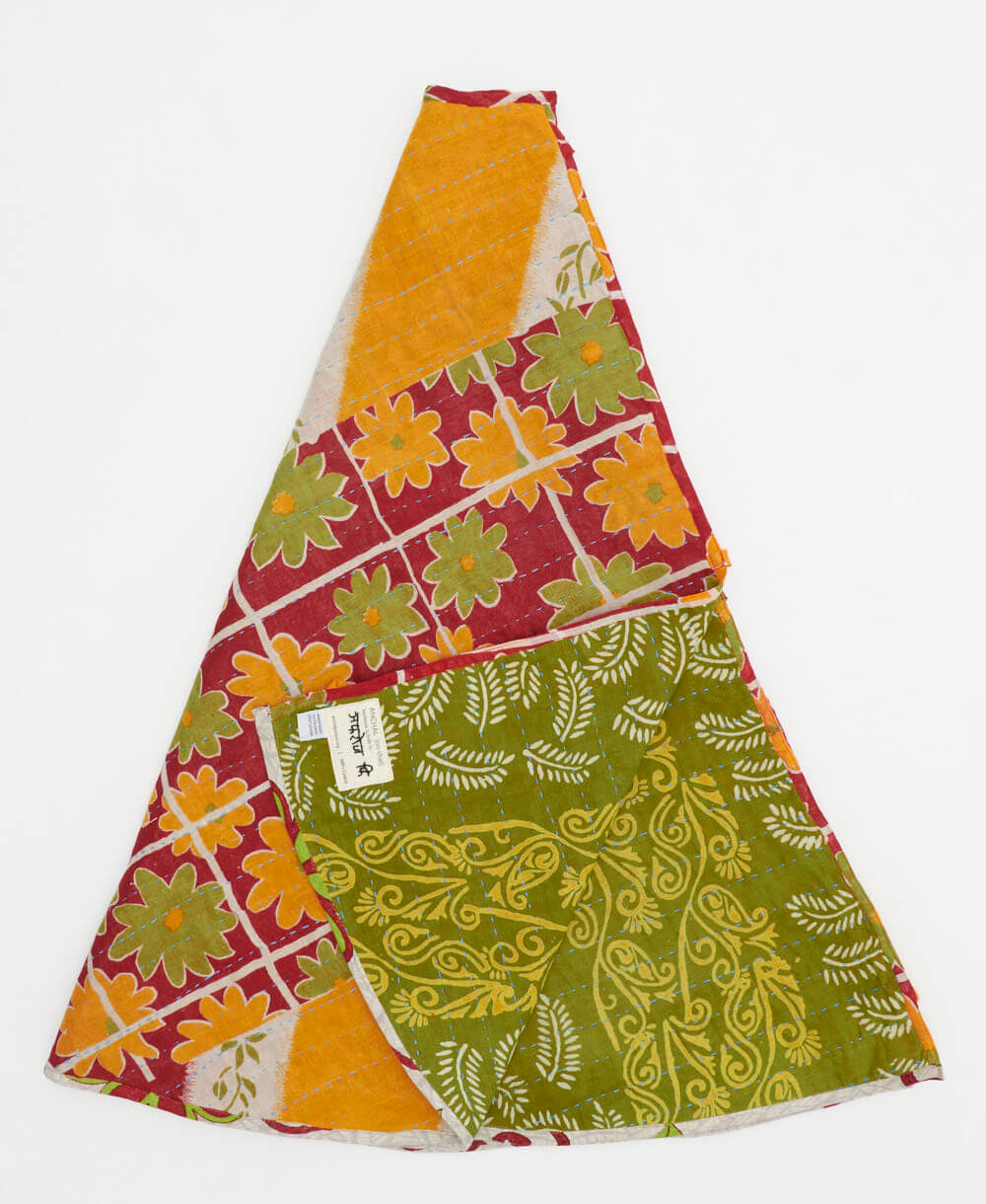 red holiday tree skirt made from vintage cotton saris featuring a yellow & green floral grid pattern with olive abstract reverse