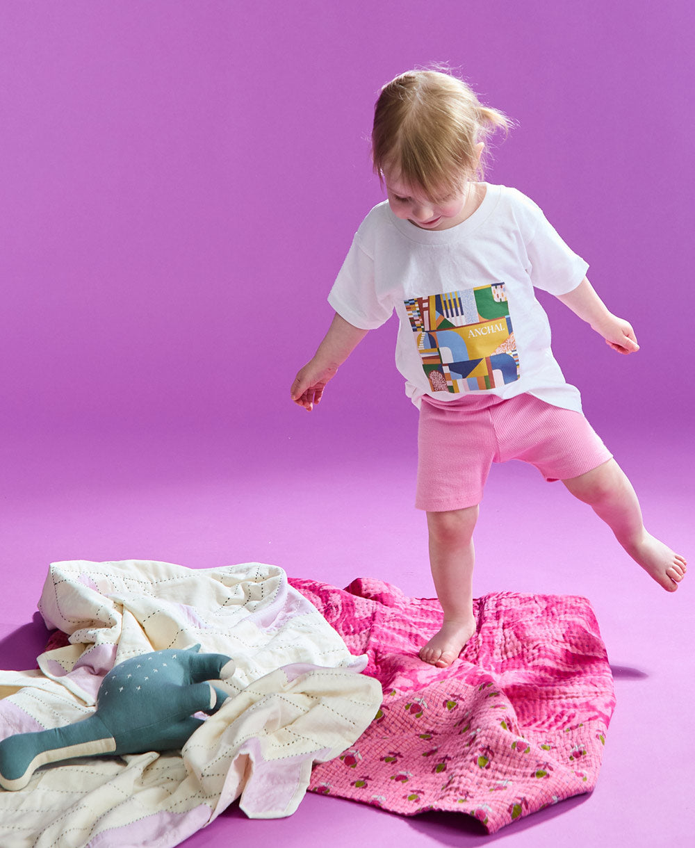 Little girl wearing kids logo t shirt
