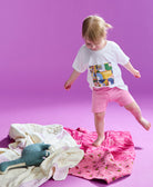 Little girl wearing kids logo t shirt