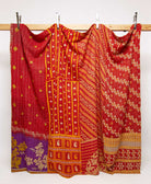 bright red king kantha quilt in a bold yellow floral pattern handmade in India