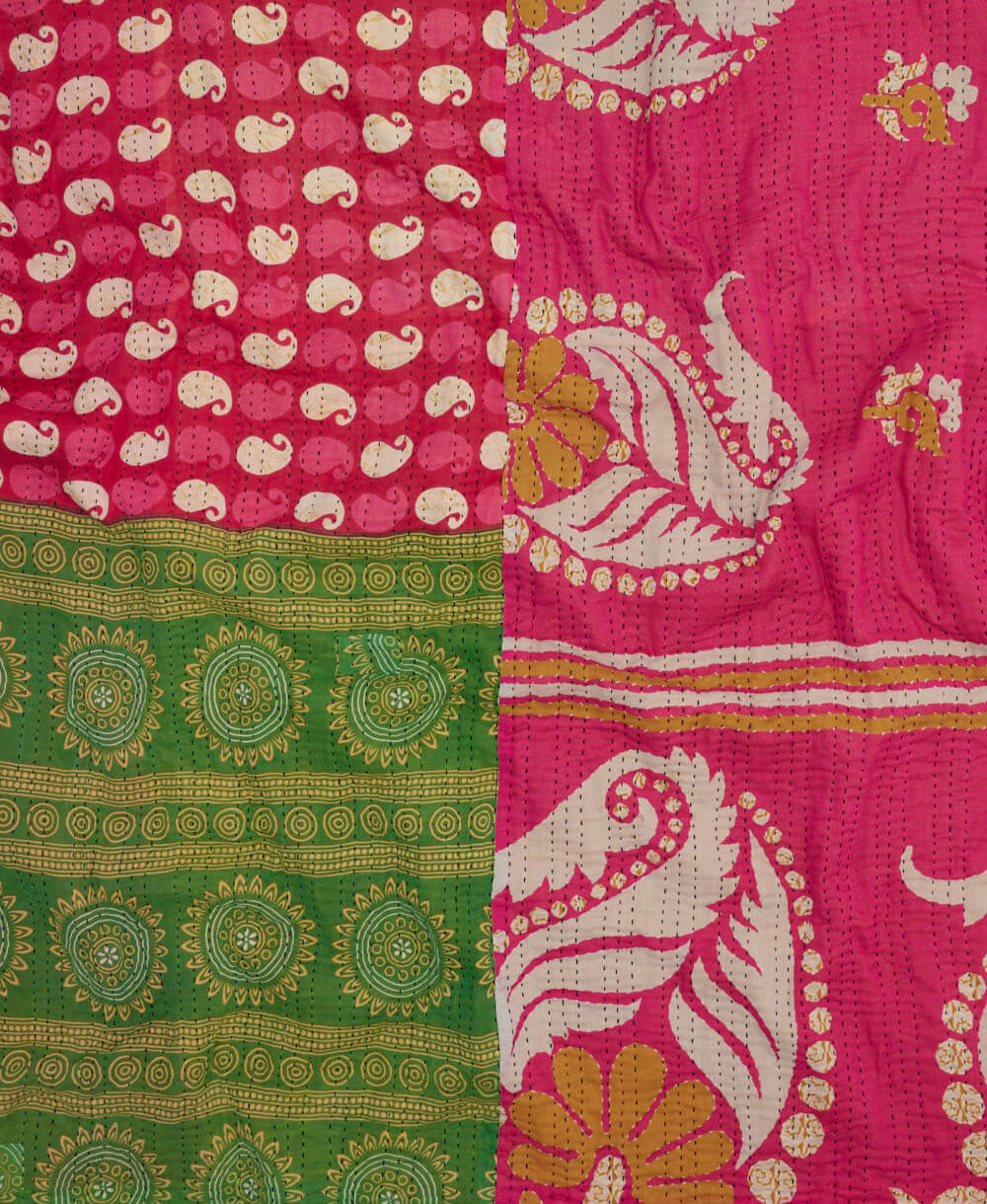 sustainable kantha quilt in king size with a deep pink paisley pattern made in India