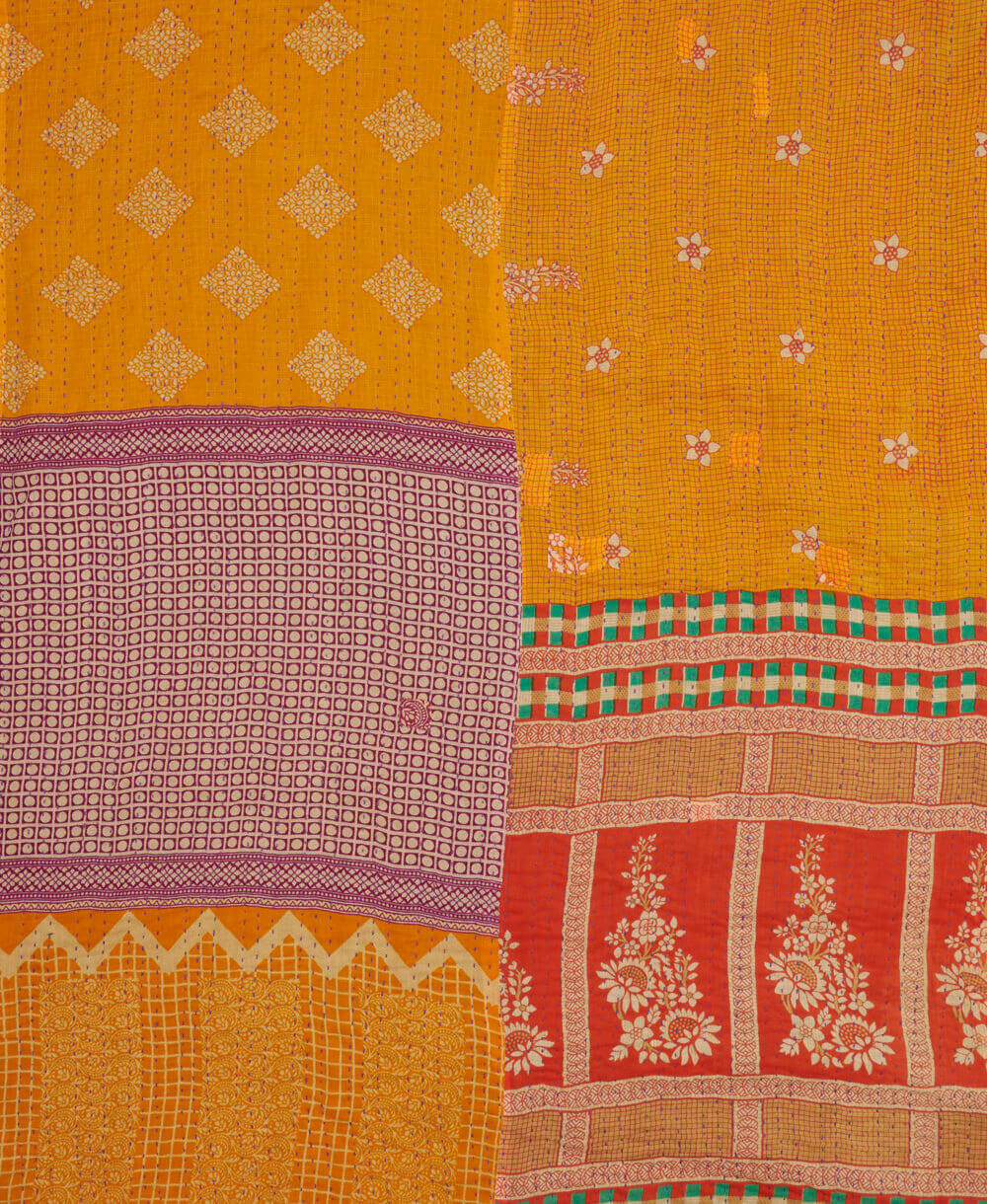 sustainable kantha quilt in king size with a marigold floral pattern made in India