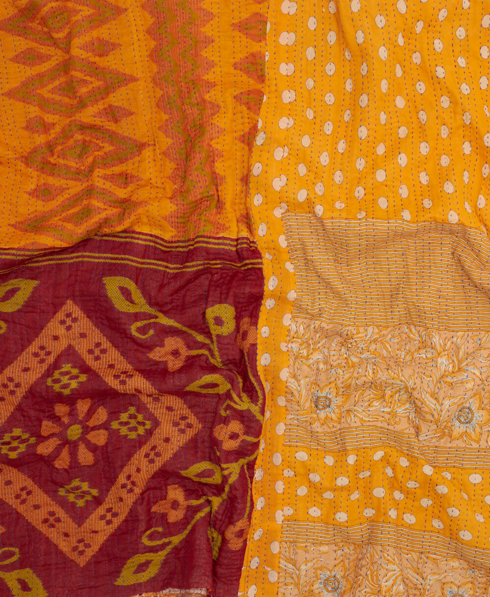 soft king kantha blanket in a golden yellow polka dot print made from upcycled vintage cotton saris