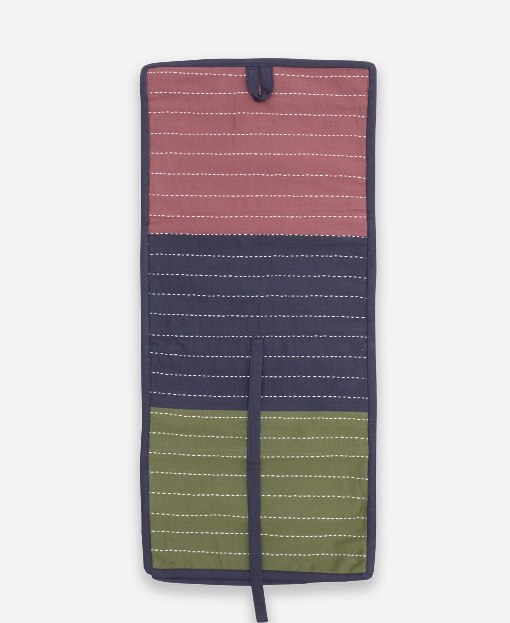 Multicolored striped travel organizer with purple, navy, and green sections on a white background
