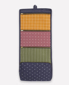 Multicolored fabric organizer with patterned sections on a white background