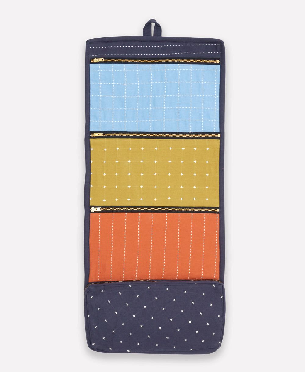 colorful travel organizer on white background with hanging loop