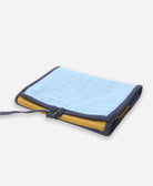 foldable travel organizer made from organic cotton with sky blue, ochre yellow and orange