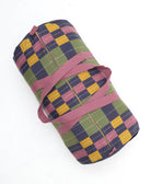 Colorful checkered bag with a pink strap on a white background