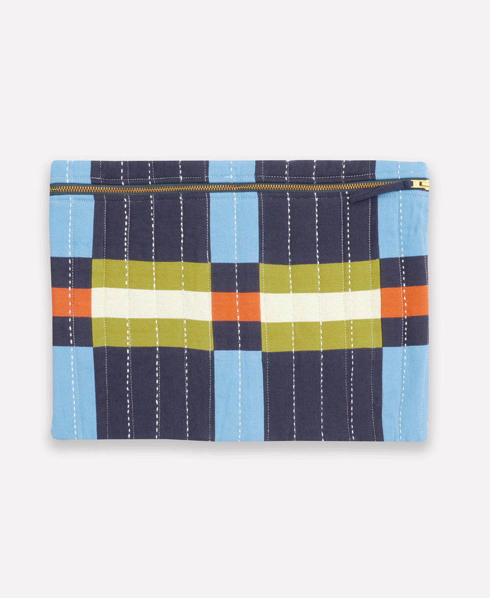 Plaid patterned padded laptop sleeve with colorful stripes on a white background