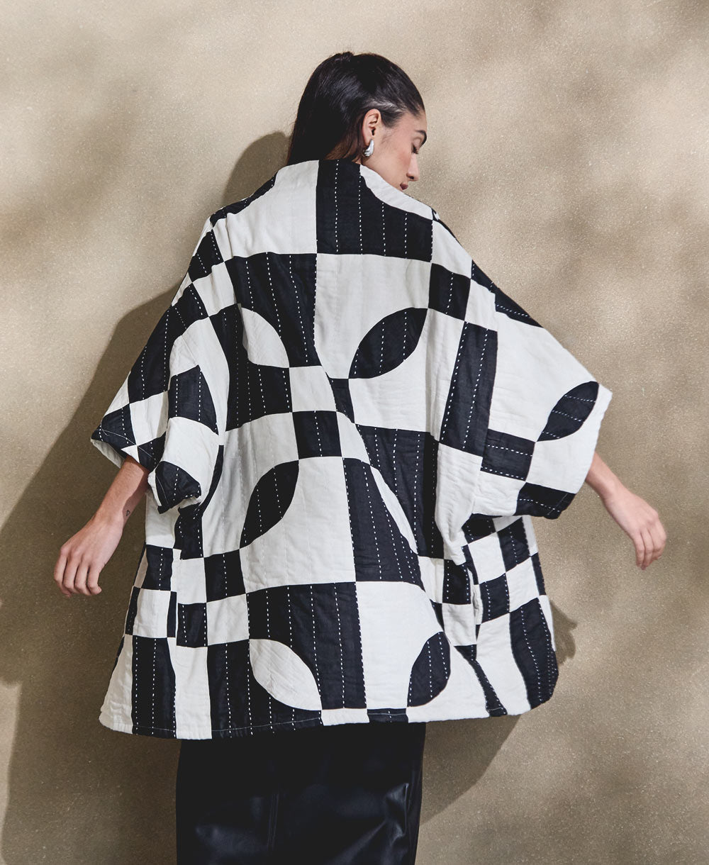 ethically made black and white quilted jacket made from 100% organic cotton in bold patchwork design