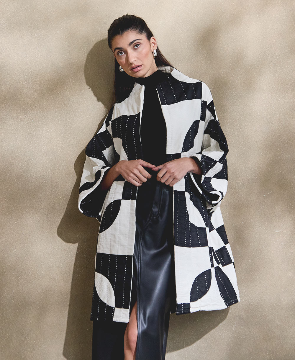 black and white quilted jacket in cocoon silhouette with bold marquise shaped patchwork