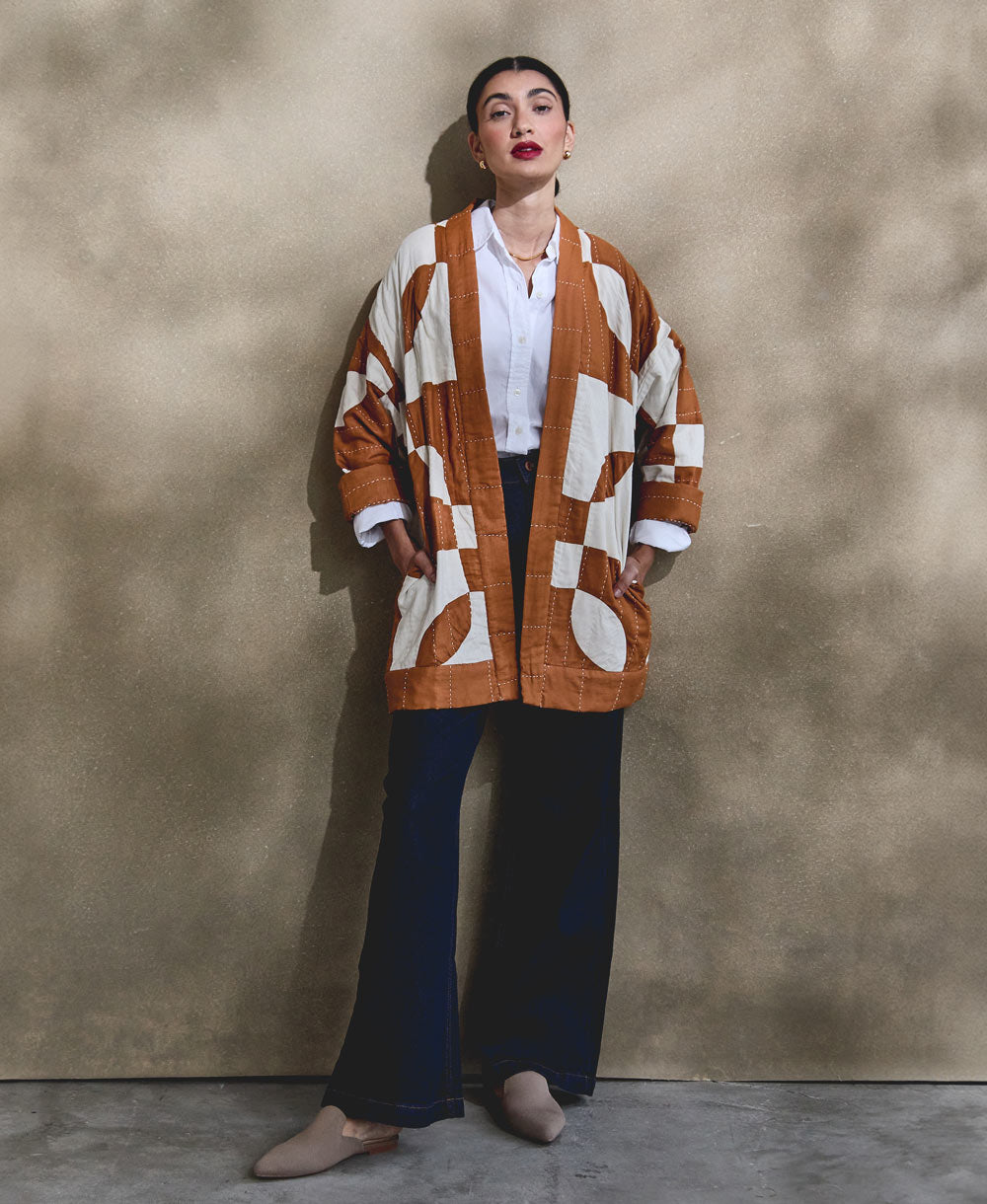 modern sustainable quilted jacket in camel and natural white patchwork with open front design styles with dark wide leg jeans