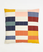 colorful throw pillow in rainbow checkered pattern accented with white kantha embroidery