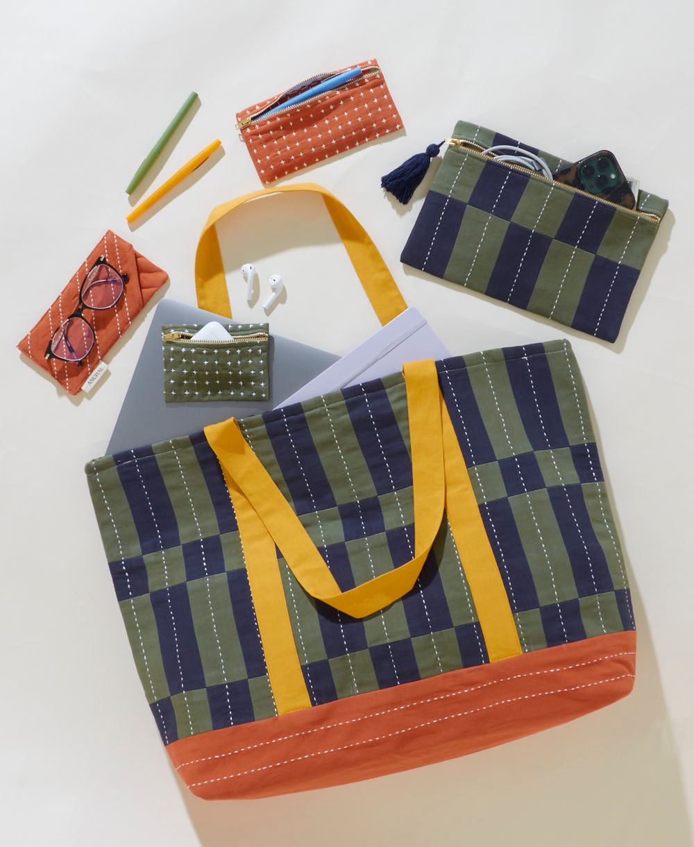 Set of fabric bags and pouches with checkered pattern on a white background