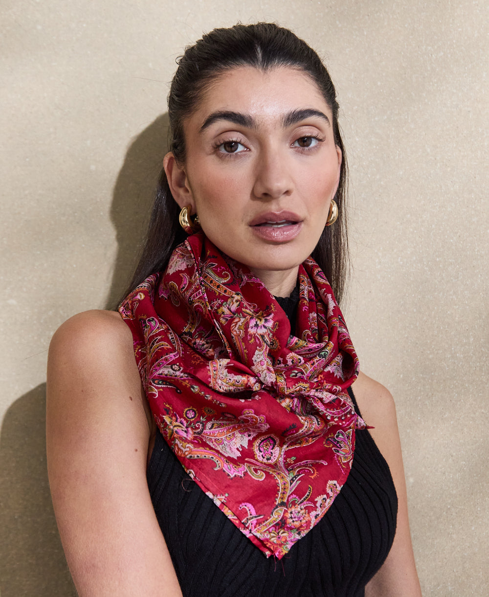 woman wearing red paisley silk scarf handmade in India from vintage silk saris