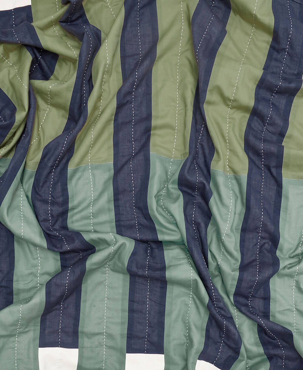 cool toned striped quilted throw crafted from 100% organic cotton in India by women artisans