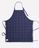 100% organic cotton navy blue bib apron with handstitched embroidery by women artisans