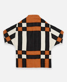 ethically made quilted jacket in modern plaid pattern in camel, black and natural white