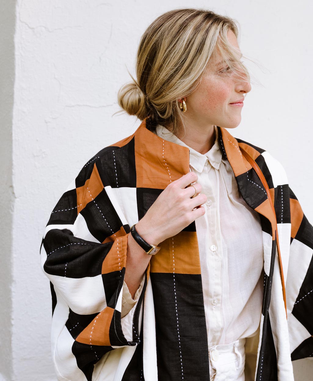 modern cocoon quilted jacket in bold patchwork plaid pattern with striking white embroidery