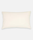Beige rectangular pillow on a white background