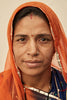 video narrative story of Anchal artisan Sita & portrait of her in orange sari draped over her head