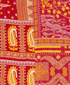 soft queen kantha blanket in an orange and red paisley pattern made from upcycled vintage cotton saris