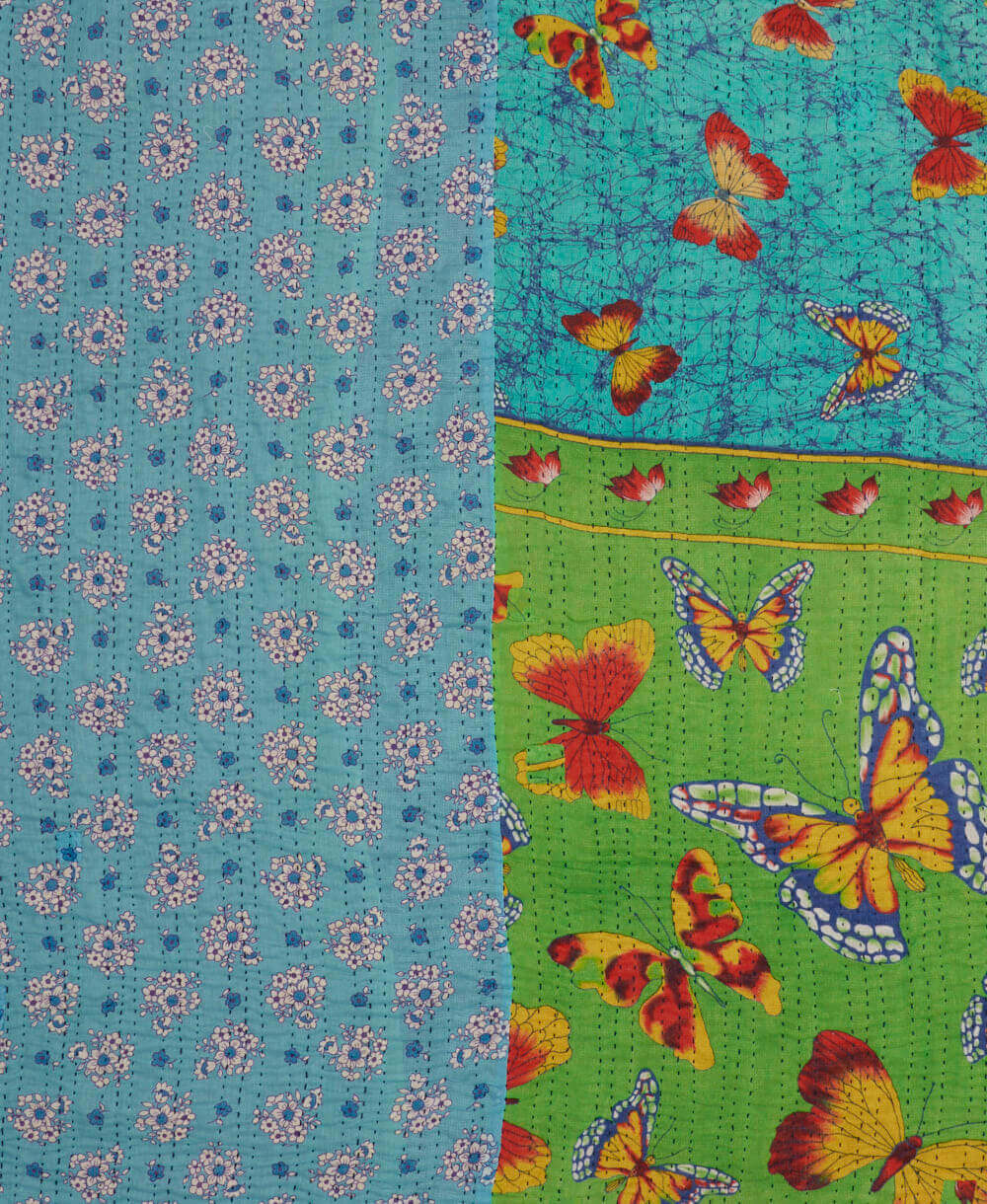 kantha stitched blanket in sky blue and yellow butterflies with blue kantha stitching