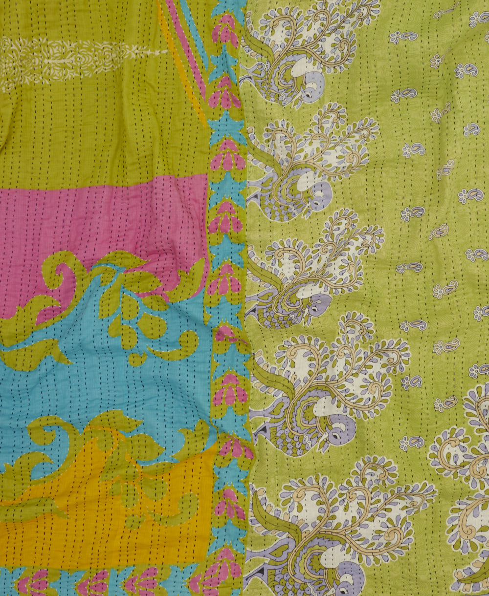 lime green kantha stitched blanket in pink and blue abstract pattern with blue kantha stitching