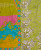 lime green kantha stitched blanket in pink and blue abstract pattern with blue kantha stitching