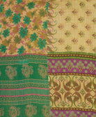 beige kantha blanket in queen size with green floral pattern and hunter green chevron pattern