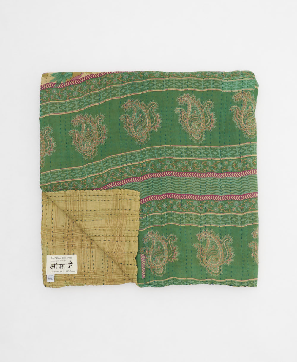 ethically made queen kantha quilt in beige with bright green florals and red paneling by Anchal artisans