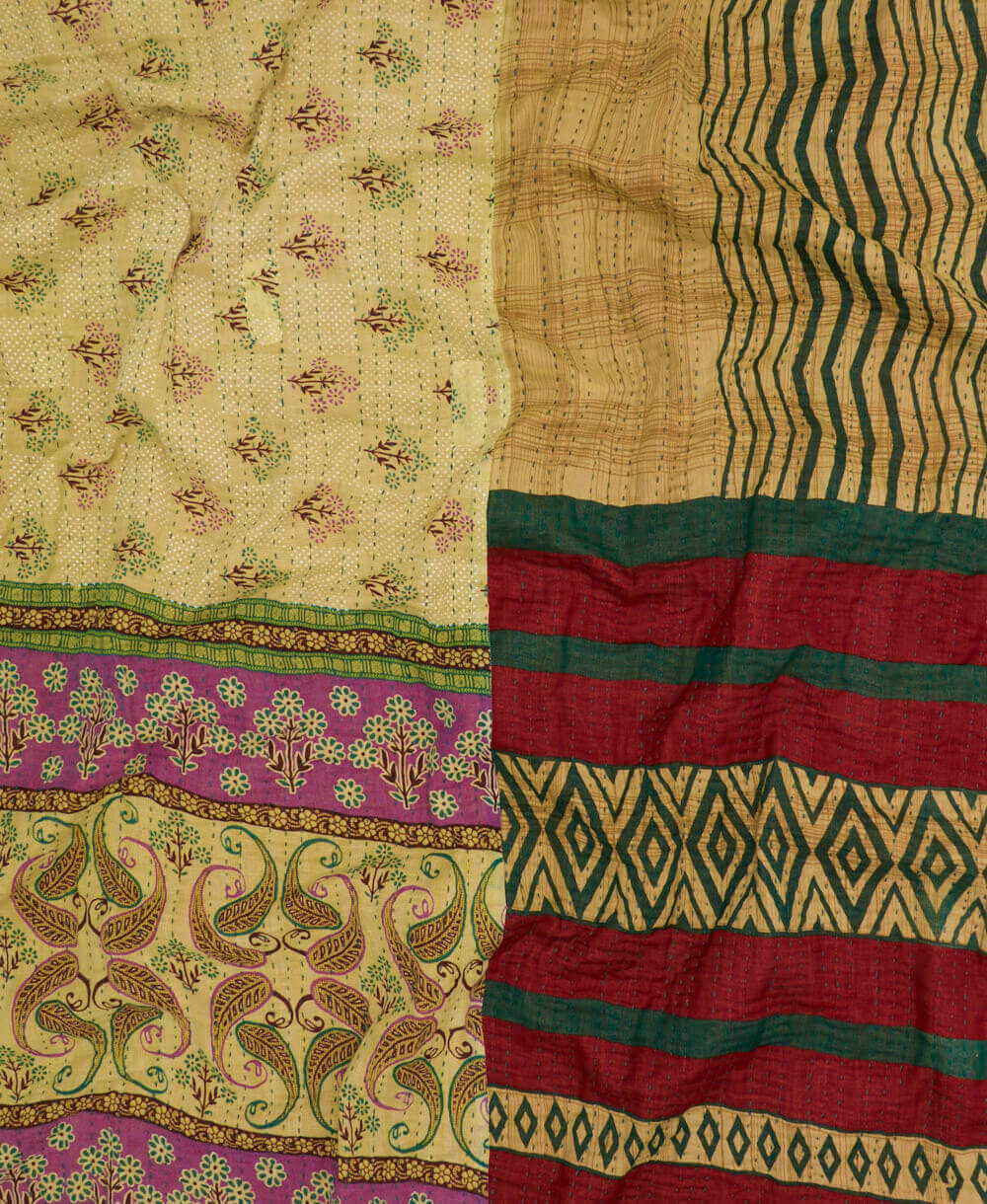 artisan-made kantha quilt in beige and green floral and chevron patterns