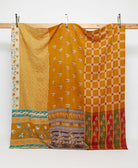 tangerine orange queen kantha quilt with a red checkered pattern handmade in India