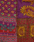 artisan-made kantha quilt in plum purple and golden yellow paisley design made from upcycled vintage cotton saris